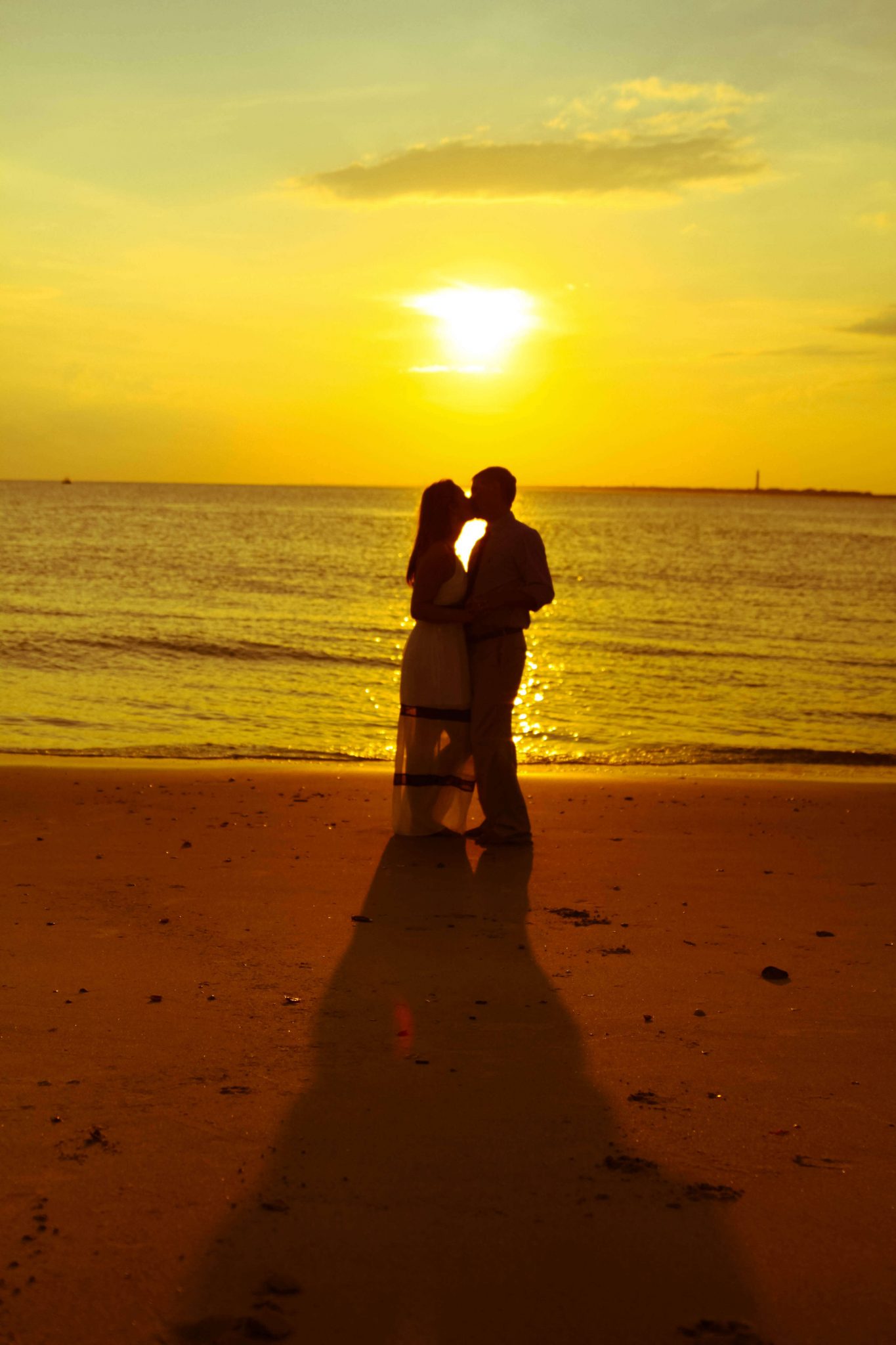 Beautiful Couple embrace on the beach in Charleston, SC
